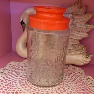 Vintage tang Embossed Glass Jar Lillie’s of the valley  Orange Lid